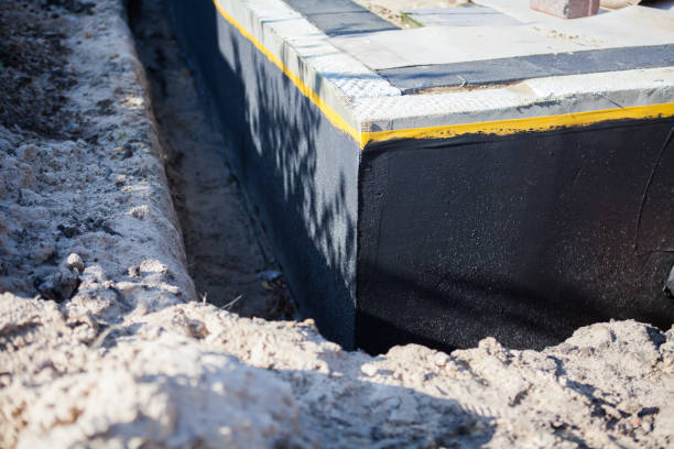 Professional Exterior Waterproofing technician working in Pelham, AL